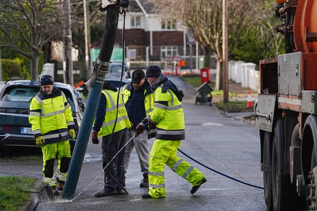 Slaney Search and Rescue crew members distributed food and water that had been donated to them to people stuck in their houses.