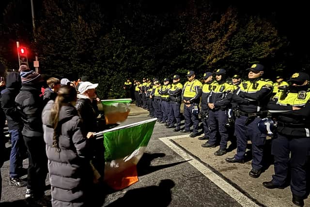 Public order gardai pushed the crowd further from the hotel by advancing on them with shields.