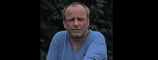 When last seen, he was wearing a black t-shirt and navy chinos