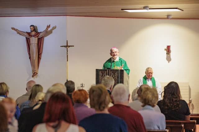 Bishop Alan McGuckian leads a mass at St Colmcille’s Church in Downpatrick, Co Down, following the sudden death of Stephen Brannigan and an attack on priest Father John Murray. (Liam McBurney/PA)