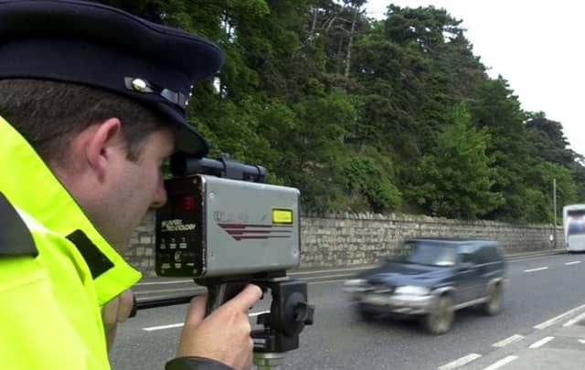 A Garda at a roadside speed check