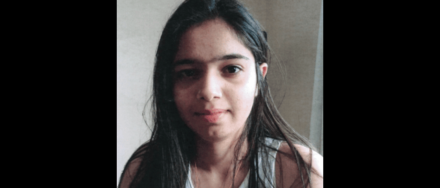 When last seen, she was wearing a blue and black-striped top, grey jeans and black runners