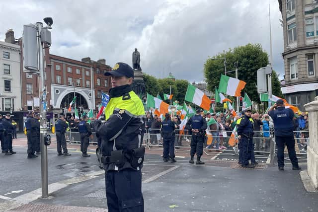 Participants from both sides shouted and gestured towards each other from across the empty space between the barriers created by gardai.