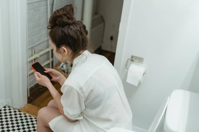 ALERT: Grim warning to people who use their phone in the toilet amid virus fears