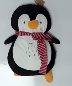 The item in question is a penguin shaped cushion. A safety issue was identified as the red scarf worn by the penguin is longer than safety guidelines and can pose a risk of strangulation. 