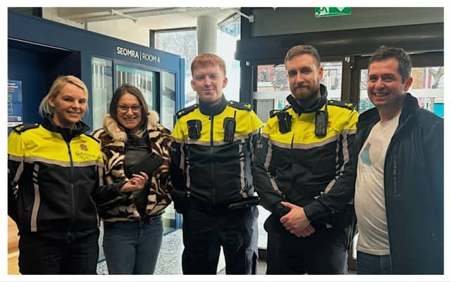 Gardaí return the stolen phone to tourists Marina and Christian at O'Connell Street Garda Station.