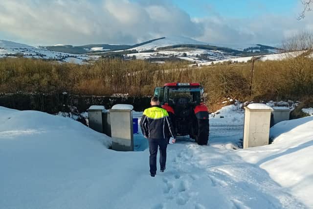 Garda Clifford travelled over to meet Garda Fitzgerald, who resides in Doon, and they headed up the Reenavanna Hills in the tractor with medication.