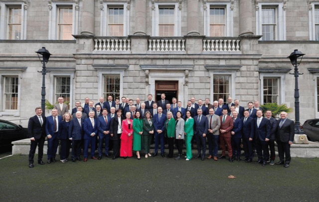 Fianna Fail TDs gather outside Leinster House, following the General Election