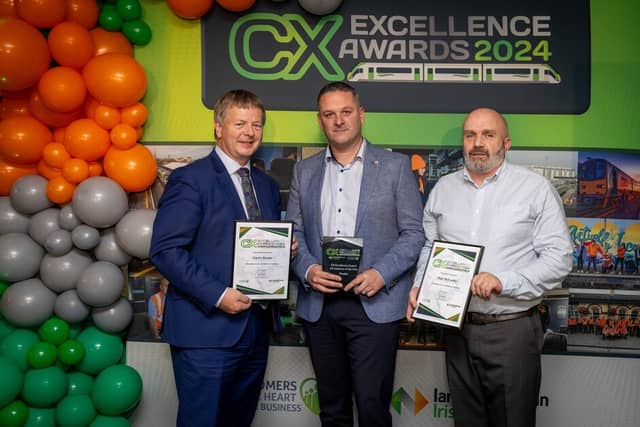 Jim Meade, Chief Executive of Iarnród Éireann presents Garry Keane and Victor Fox with their award (Paul McCarthy was not in attendance)