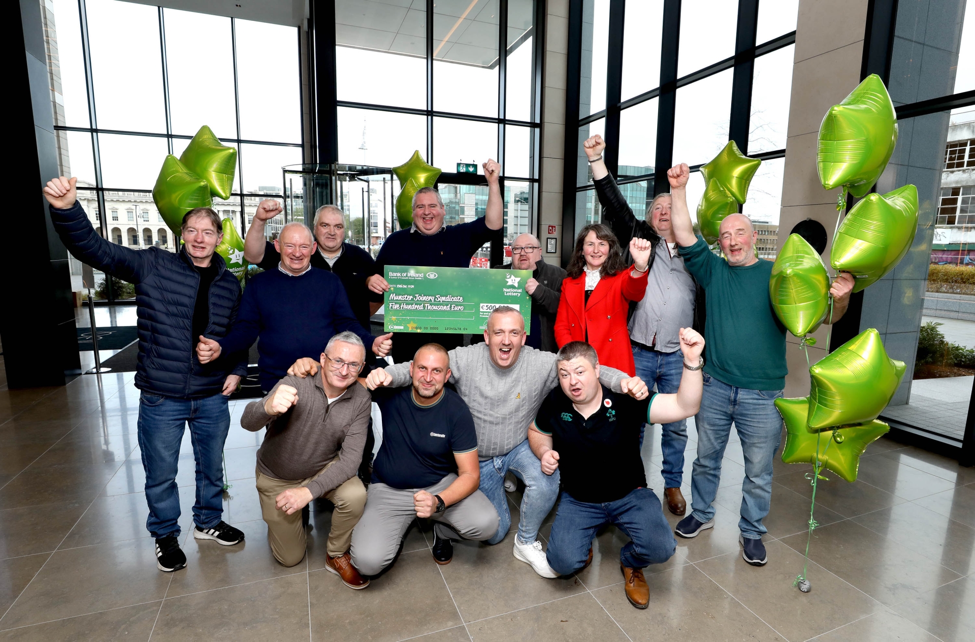 Syndicate of co-workers in disbelief as they win big Lotto prize after 13 years