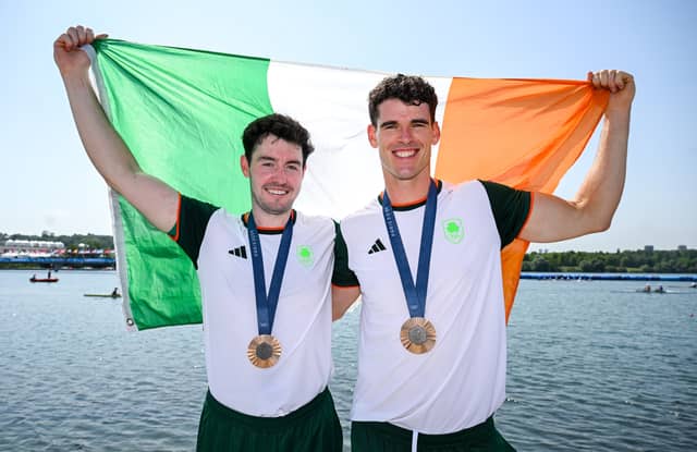 Philip Doyle, right, and Daire Lynch of Team Ireland celebrate with their bronze medals after the men's double sculls A final. Photo: Stephen McCarthy/Sportsfile
