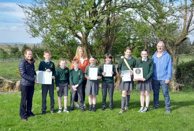 Ella Ryan WCCC with Alison Walsh and Jack O’Sullivan from Cheekpoint Faithlegg Tidy Towns and members of Faithlegg National School Student Council