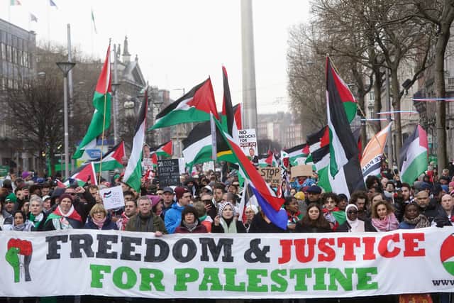 Protesters waved Palestinian flags and held placards critical of the Irish, US and Israeli governments.