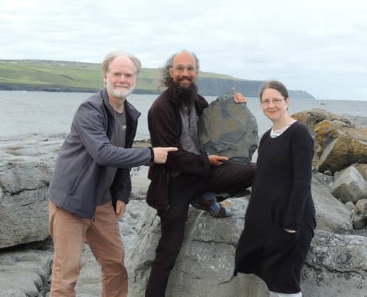 Dr. Eamon Doyle (left), Dr. Joseph Botting (centre) and Dr. Lucy Muir (right) with the new fossil sponges discovered near the Cliffs of Moher in Clare