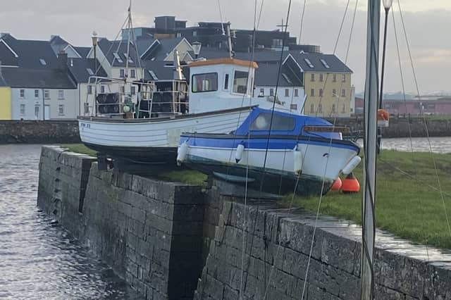 Boats brought to rest on top of Claddagh Quay in Galway after Storm Debi | PICTURE: Paul O'Brien