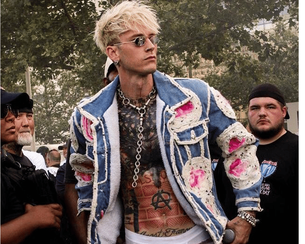 The rapper mentioned working in the studio with F1 driver Lewis Hamilton before challenging the reporter to play air guitar | PICTURE: Machine Gun Kelly Instagram page