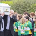 The remains of young Ronan Wilson is carried in St Mary's Church at Dunnamore by family members as it passes a guard of honour by members of the local GAA club.  (NW Newspix)