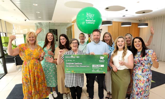 The Craigtown syndicate were pictured today celebrating in Lotto HQ collecting their €250,000 cheque after winning the Lotto Plus 2 top prize on Saturday 27th May | PICTURE: MacInnes Photography