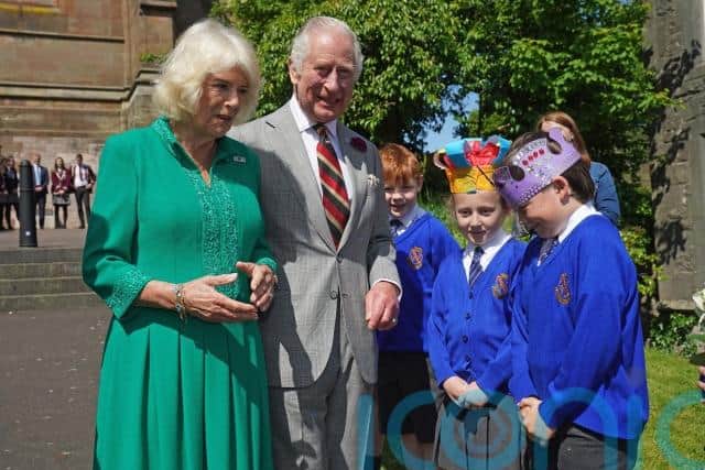 The royal couple then shook hands with several artisan food producers and were given various gifts by members of the public while a cultural performance took place on a stage at Market Theatre Square.