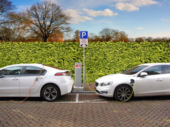 Electric cars being charged - but what happens when the juice runs low?