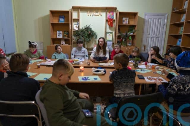 The mothers of some of the children stayed with them, seated along one of the walls, watching and listening from a distance. When Bice came, some took pictures of their children.