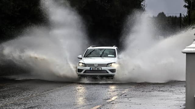 A motorist makes their way through the heavy floods on Friday morning at Glenswilly PICTURE: BRIAN MCDAID