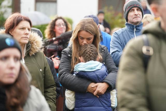 Parents hugged their children, people carried candles, prayers were said and music was played, including a song called Creeslough, written and played by a local musician.