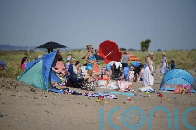 Some sun worshippers bathed in the heat, while others retreated to shaded picnic benches to take a break from the unusually high temperatures for Ireland.