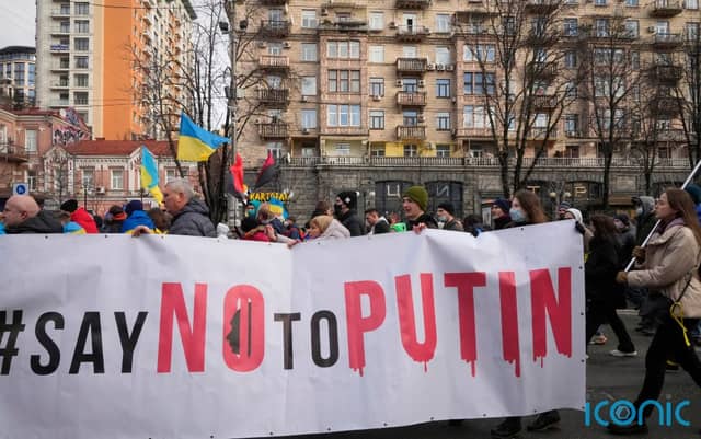 Ukrainians attend a rally in central Kyiv
