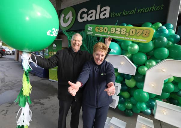 Michael and Siobhán Larkin celebrate after their store sold the winning ticket worth over €30.9 million