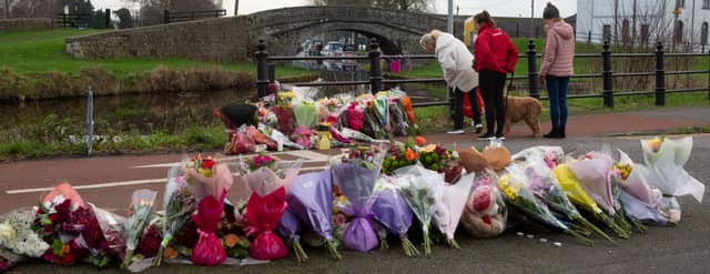 Walkers at the memorial to Ashling Murphy on the Grand Canal in Tullamore