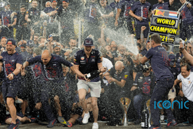 Red Bull team chief Christian Horner, right, celebrates with Max Verstappen, centre, after Sunday’s race (AP)