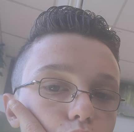 He is described as being approximately 5 foot 8 inches in height with a slim build. He has short black hair, and brown eyes.