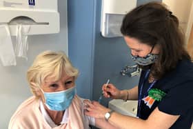 Mary Power from Tramore receives her Covid vaccine from Dr Deirdre Plant