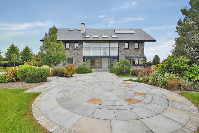 This bright and spacious property extends to approximately 342 sq.m./3,681 sq.ft. and stands amidst almost 2 acres of beautifully landscaped gardens and open countryside beyond.
