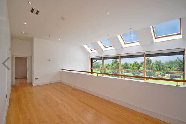 At first-floor level, you are initially greeted with a vast mezzanine which overlooks both the open-plan living area and the spectacular garden. 