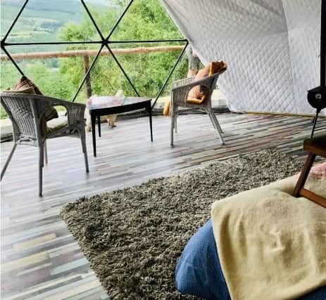 Guests can spend the night in a spacious dome that includes Irish designed Foxford luxury linens, bedding, plush towels, bathrobes, double bed, solar-powered lighting and an outdoor deck, with art deco furniture inside and out. 