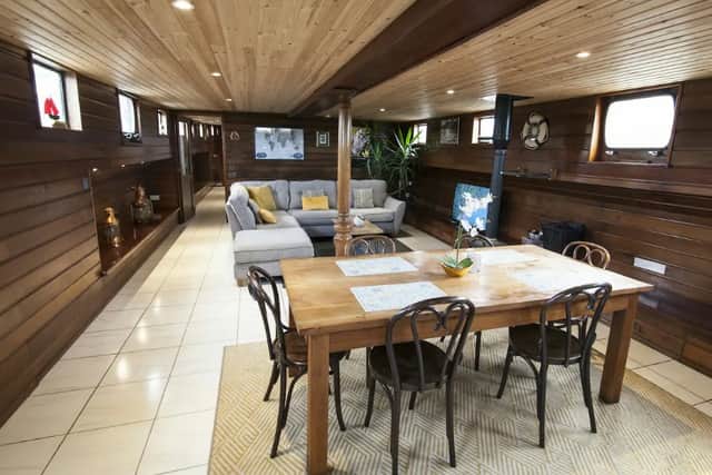 The boat is made up of a large kitchen with beautiful granite counter-tops and breakfast bar, a large open-plan dining area and lounge. The open plan lounge has a wood/turf burning stove and a wicker basket of turf will be supplied should the evenings in Galway get a little chilly and you want to snuggle up in front of a real fire.