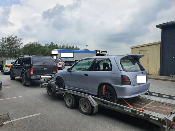Court date for disqualified driver found towing car on trailer