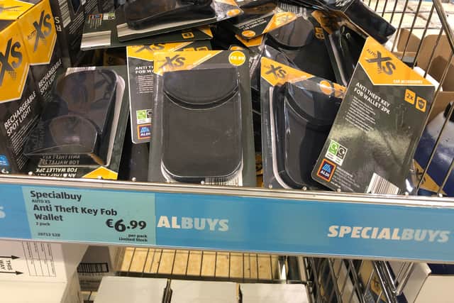 The wallet has fabric with metal woven into it to scramble signal frequencies of the key fobs.