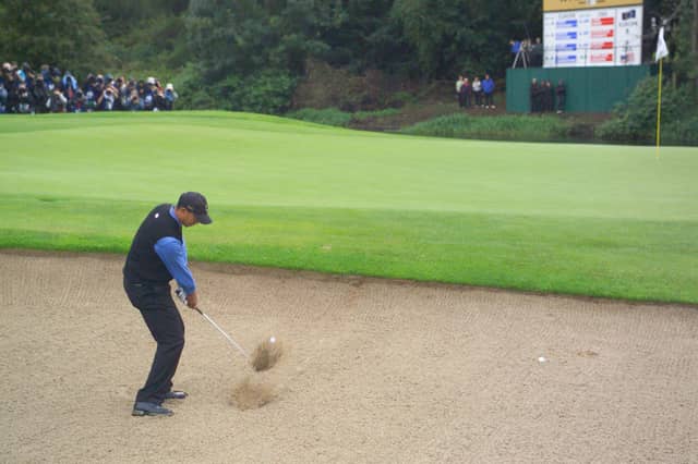 Tiger Woods blasts out of the bunker on the 1st hole during the morning fourballs session of the second day of the 2006 Ryder Cup at the K Club in Straffan, Co Kildare. Photo: Eoin Clarke/Golffile