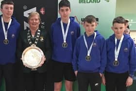 Proud coach Sheena Wilkinson and Betty Thompson from Badminton Ireland presenting the under 14 All-Ireland title to the boys of Blackwater Community School