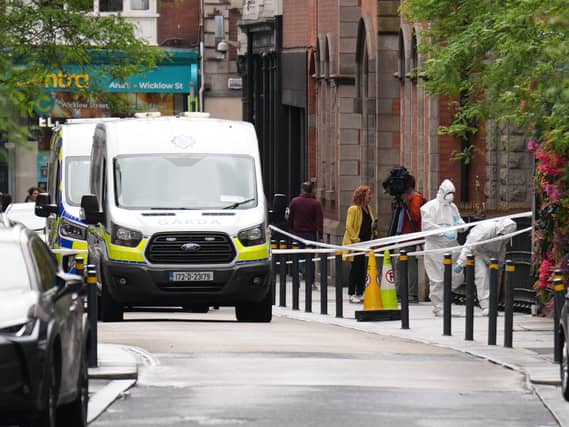 Forensic officers at work in a city street