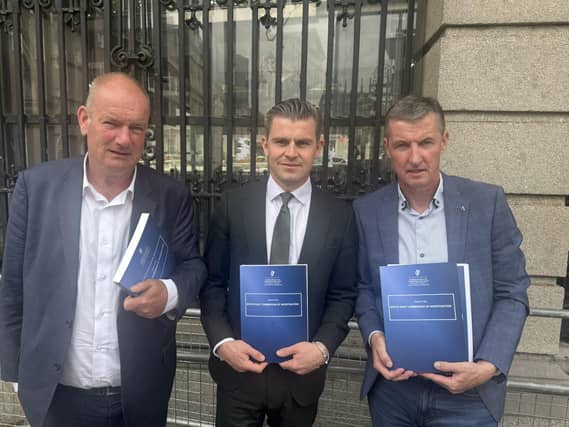Jason Clancy, Darragh Mackin, Colin Power outside Leinster House following a meeting with Minister for Justice Jim O'Callaghan