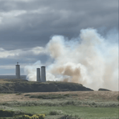 The large cloud of smoke that can be seen in front of the Metal Man