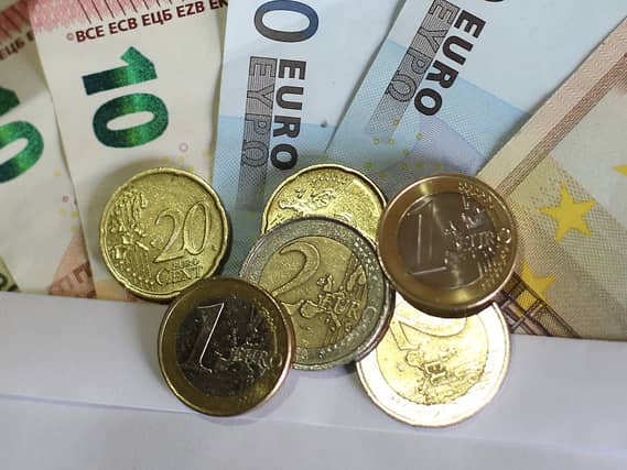 A pile of euro notes and coins