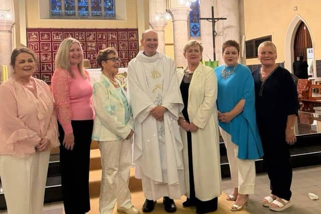 Fr Richard O’Halloran pictured alongside his mother and sisters