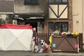 Floral tributes outside the scene of the fire in Birchwood