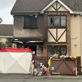 Floral tributes outside the scene of the fire in Birchwood