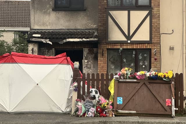 Floral tributes outside the scene of the fire in Birchwood